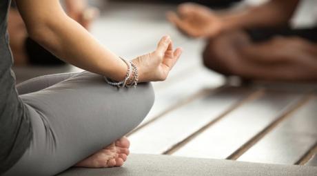 Three people meditating